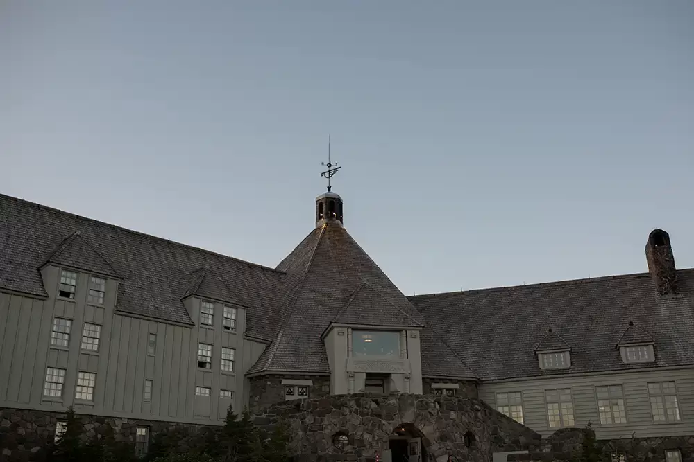 
Wedding at Timberline Lodge, the lodge stands in the light after dusk