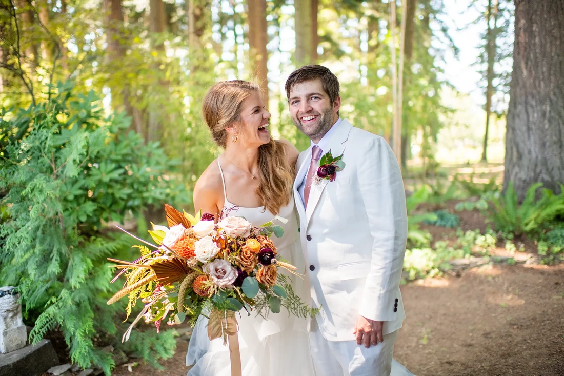 Portland Oregon Wedding Photographer Robert Knapp at ​Miller Farm Bride and groom have a laugh in the forest with Portland Oregon Wedding Photographer