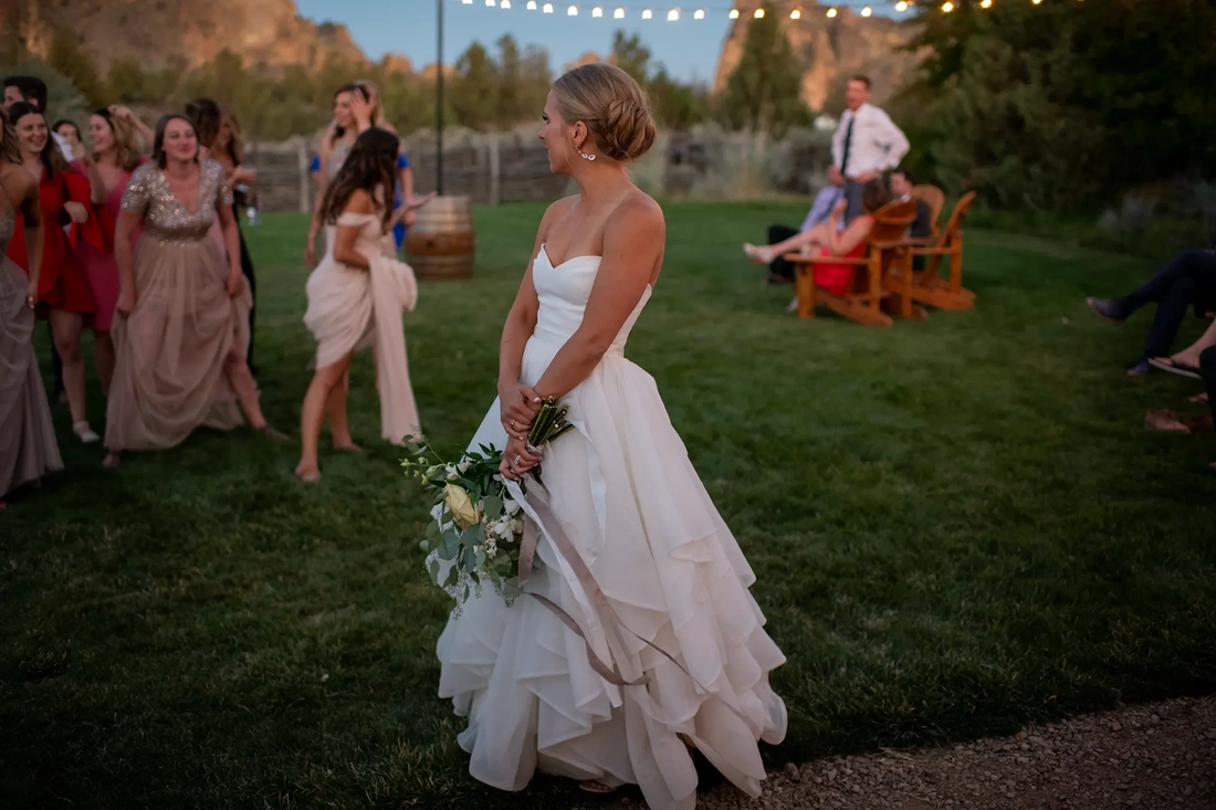 Wedding Photographers in Bend Oregon  Modern Art Photograph's photography from a Ranch at the Canyons Wedding bride prepares to toss the bouquet Wedding Photographers in Bend Oregon  Modern Art Photograph's photography from a  ​Ranch at the Canyons Wedding
